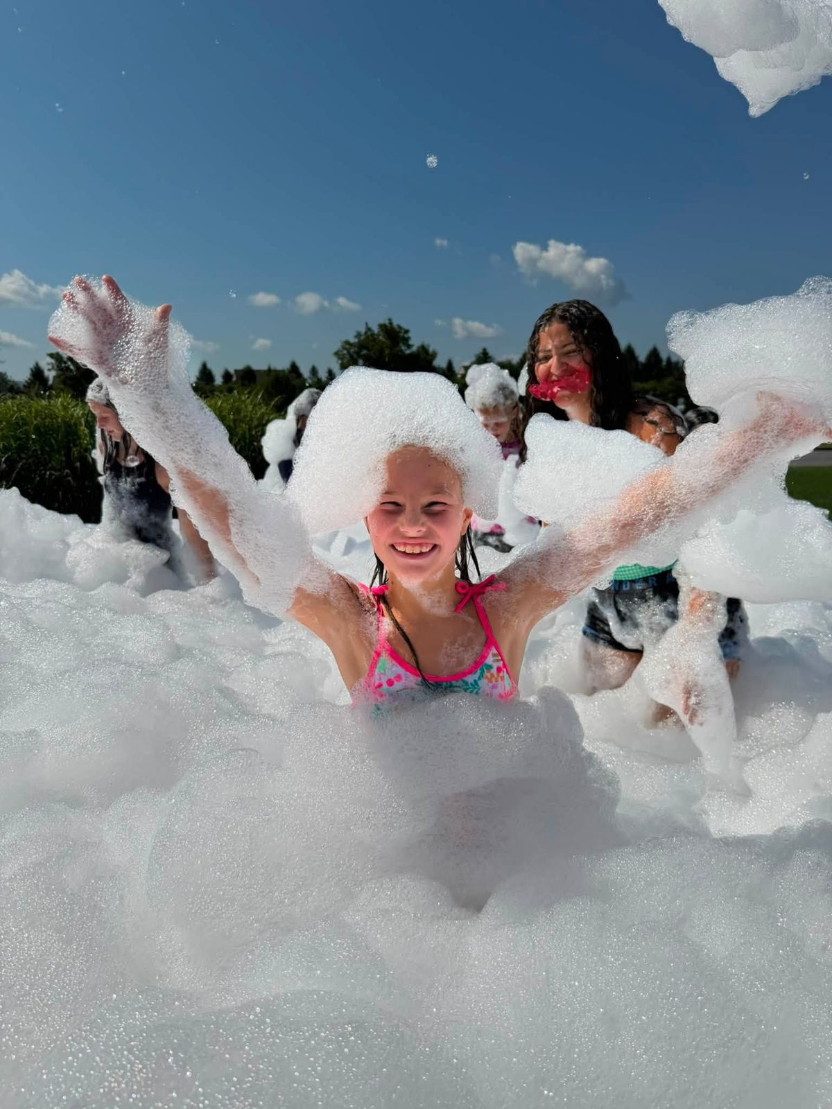 Girl covered in foam at a Points Up foam party